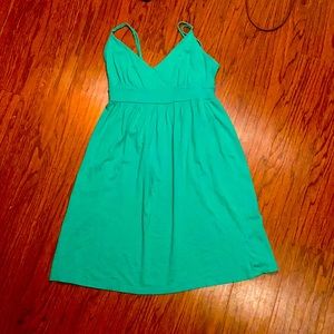 Green, v-neck dress.